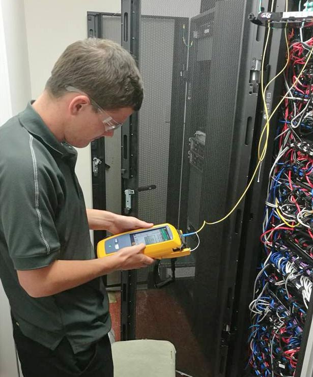 Technician using a high-tech cable power meter